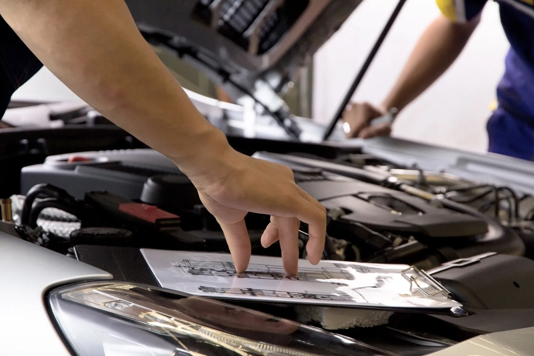 Professional car mechanic working on auto repair